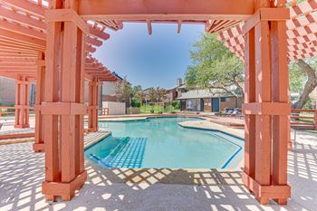 A pool surrounded by orange pillars.